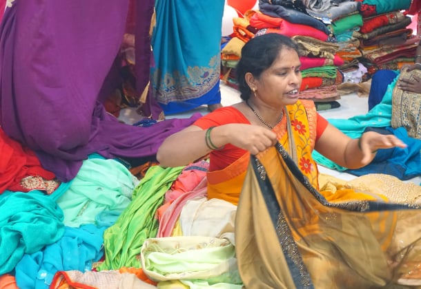 A Kaleidofin customer at a market, representing India's informal economy